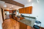 The remodeled kitchen with stainless steel appliances